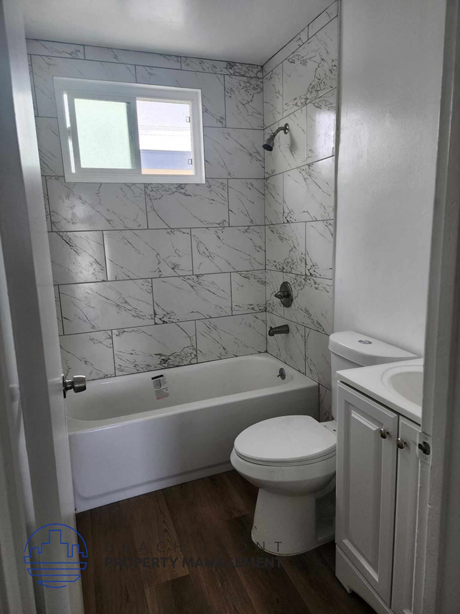 an overhead view of a bathroom with a toilet and a window