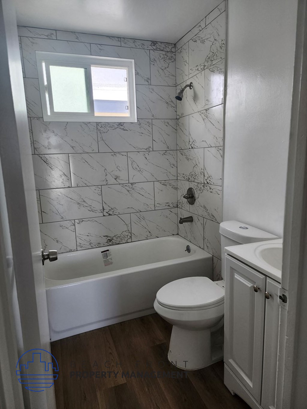 an overhead view of a bathroom with a toilet and a window