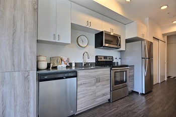 CREW Apartments Apartment Home Kitchen Dishwasher and Refrigerator - Photo Gallery 16