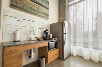 CREW Apartments Lounge Kitchen with Refrigerator and Microwave - Photo Gallery 26