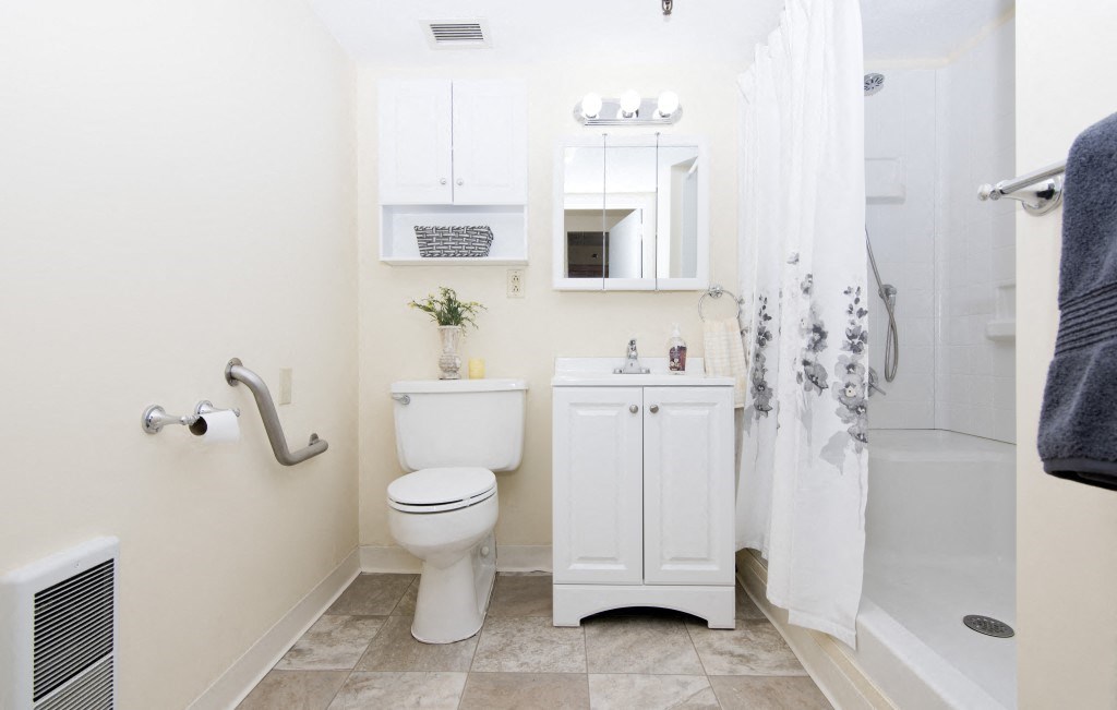 a small bathroom with a toilet and a shower