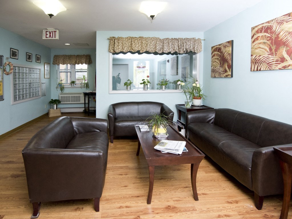 a living room with leather couches and a coffee table