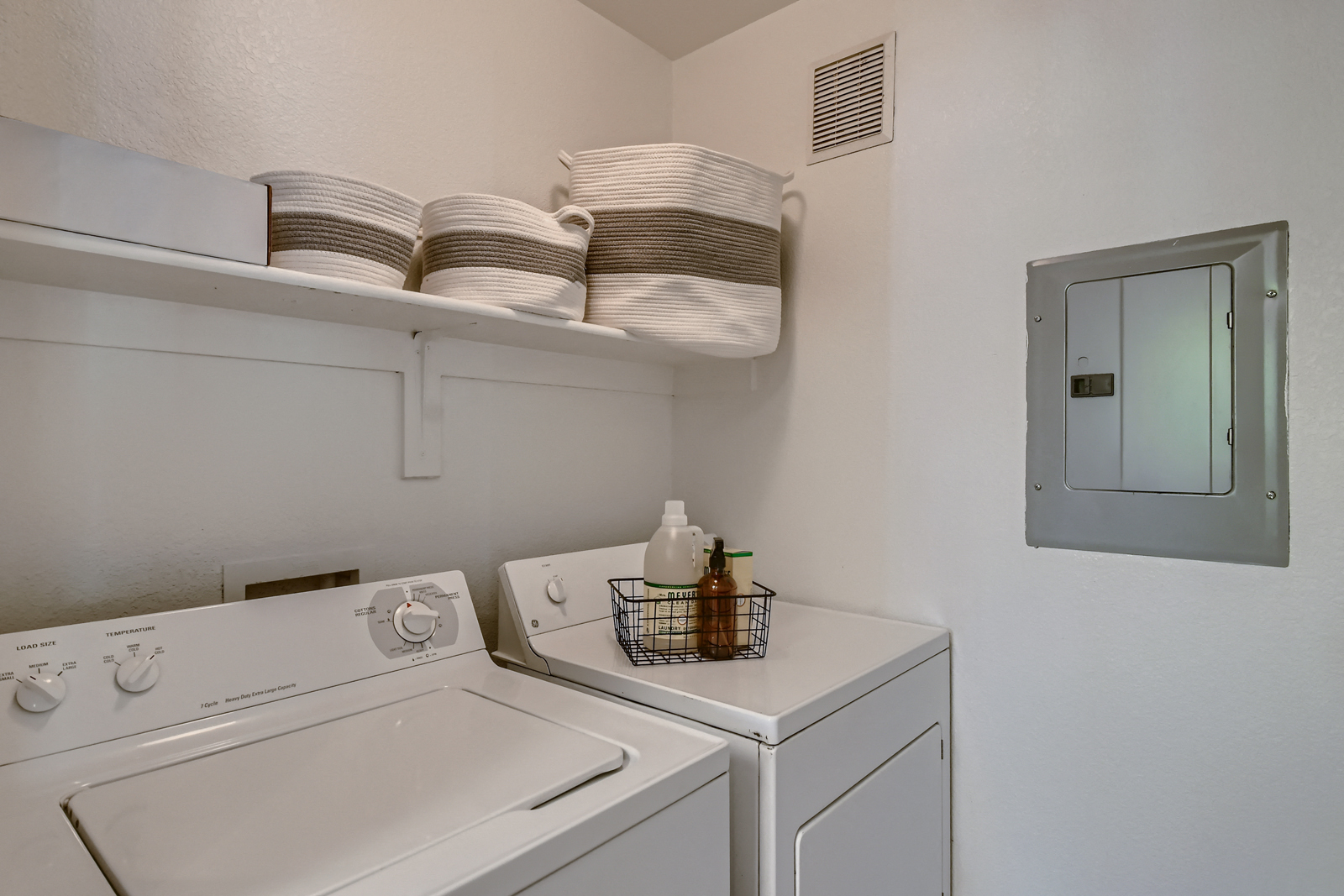 the laundry room has a washer and dryer and a window
