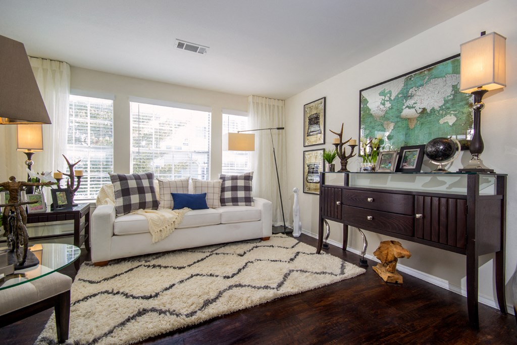 a living room with a couch and a dresser