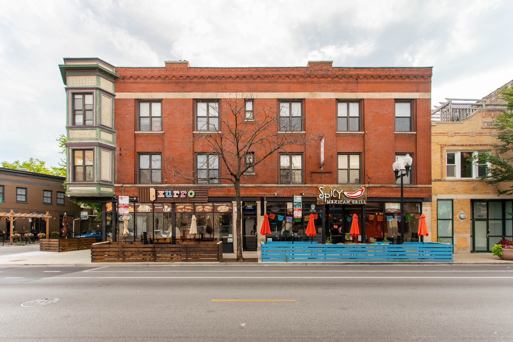 a street view of a brick building on a city street