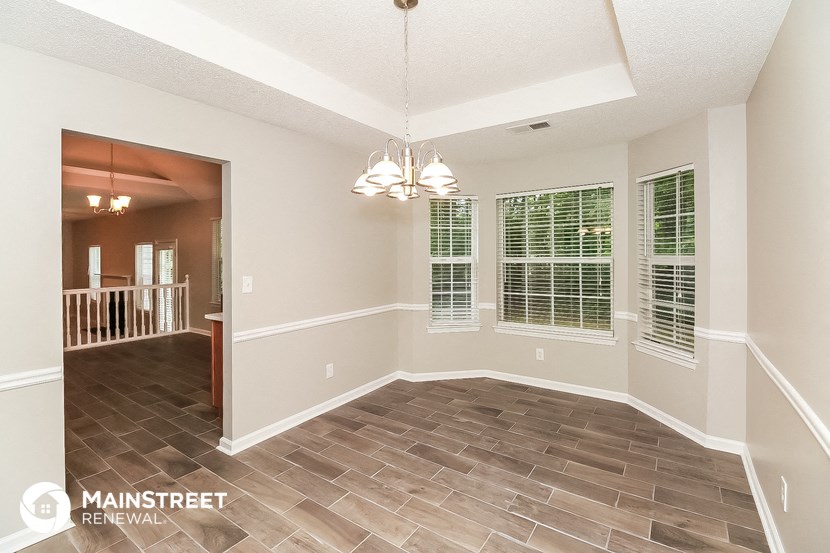 the dining room and living room of an open floor plan