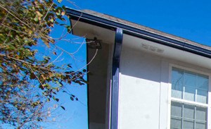 White and gray exterior siding on exterior of buildings