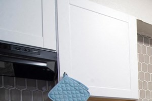 White cabinets with black appliances