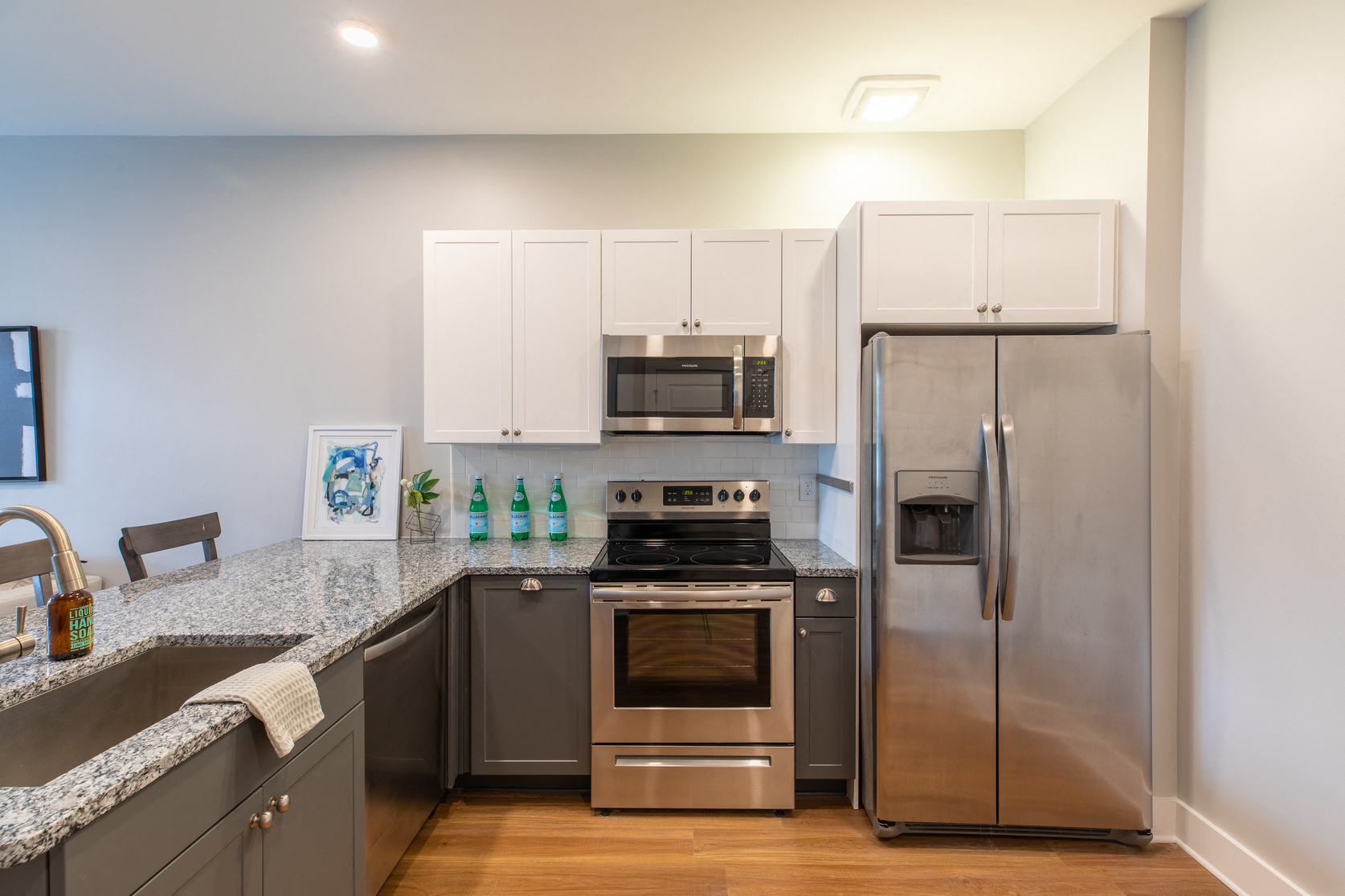 a kitchen with stainless steel appliances and granite counter tops