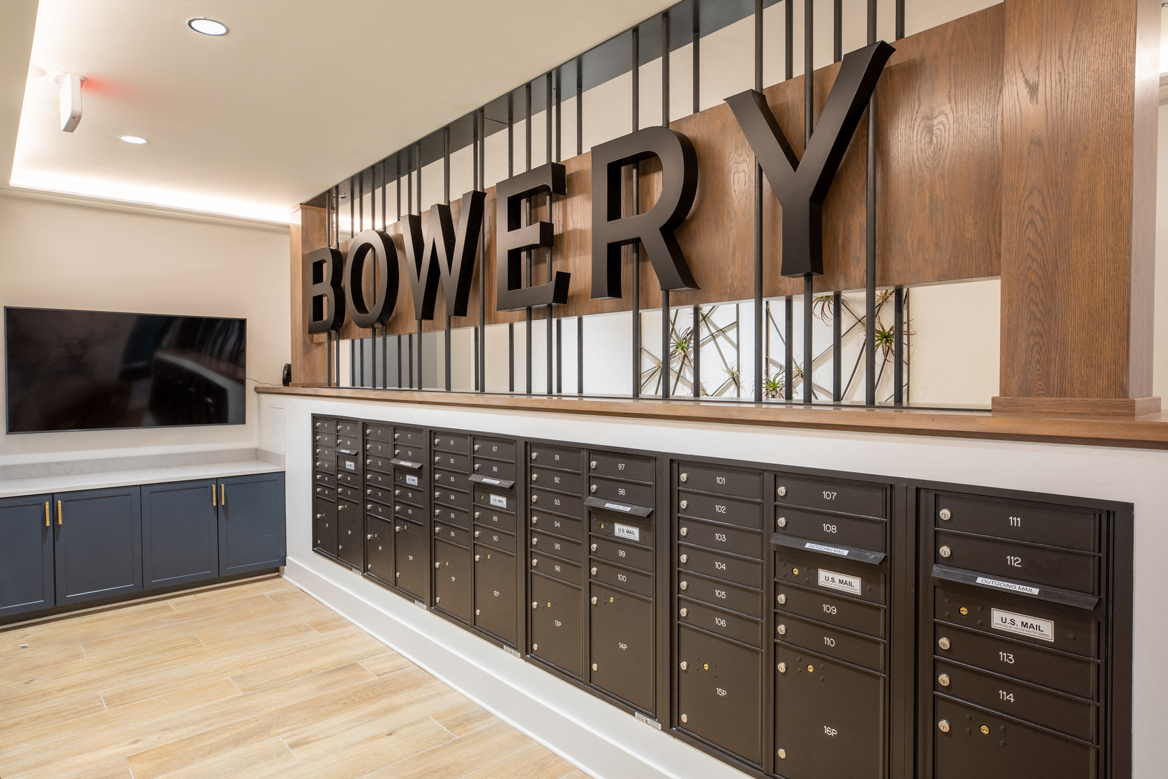 a locker room with a row of lockers and a sign that says bowey