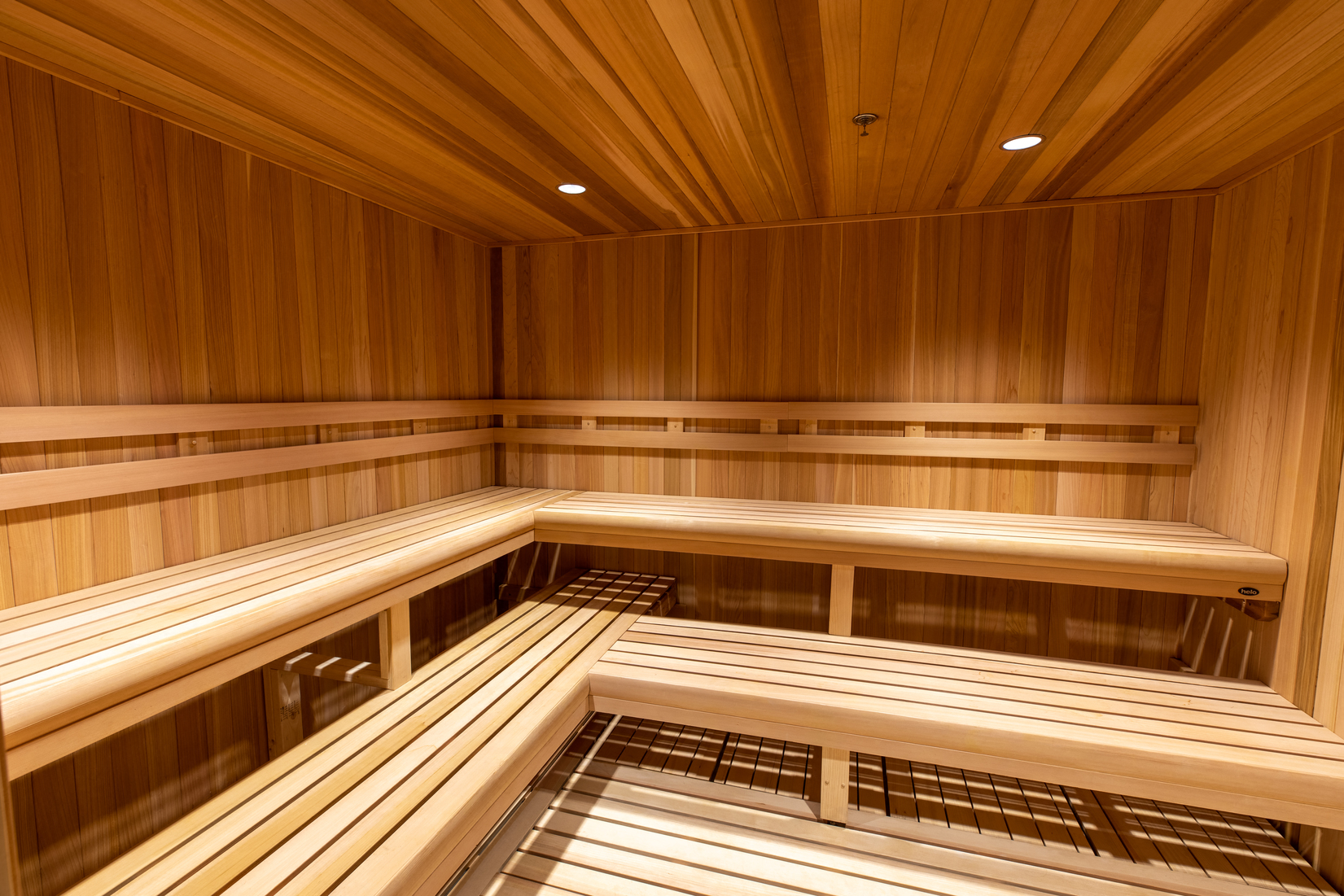 a wooden sauna with wooden walls and floors