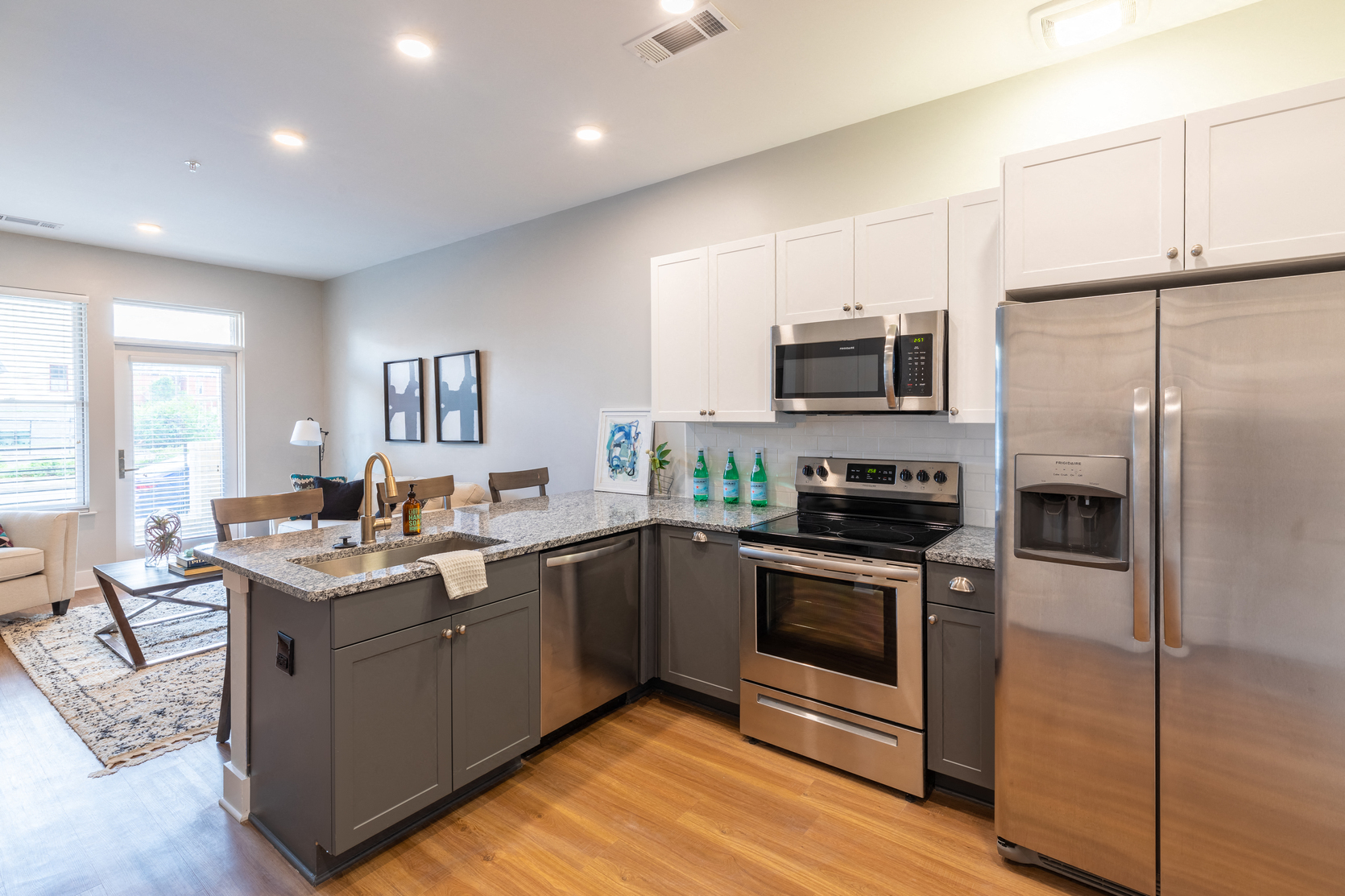 a kitchen with stainless steel appliances and a granite counter top