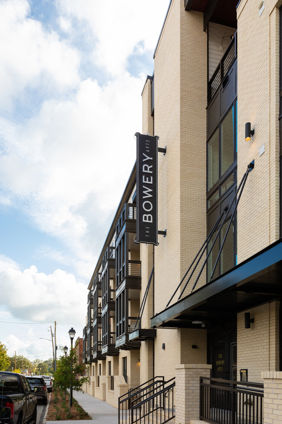 a building with a black sign on the side of it