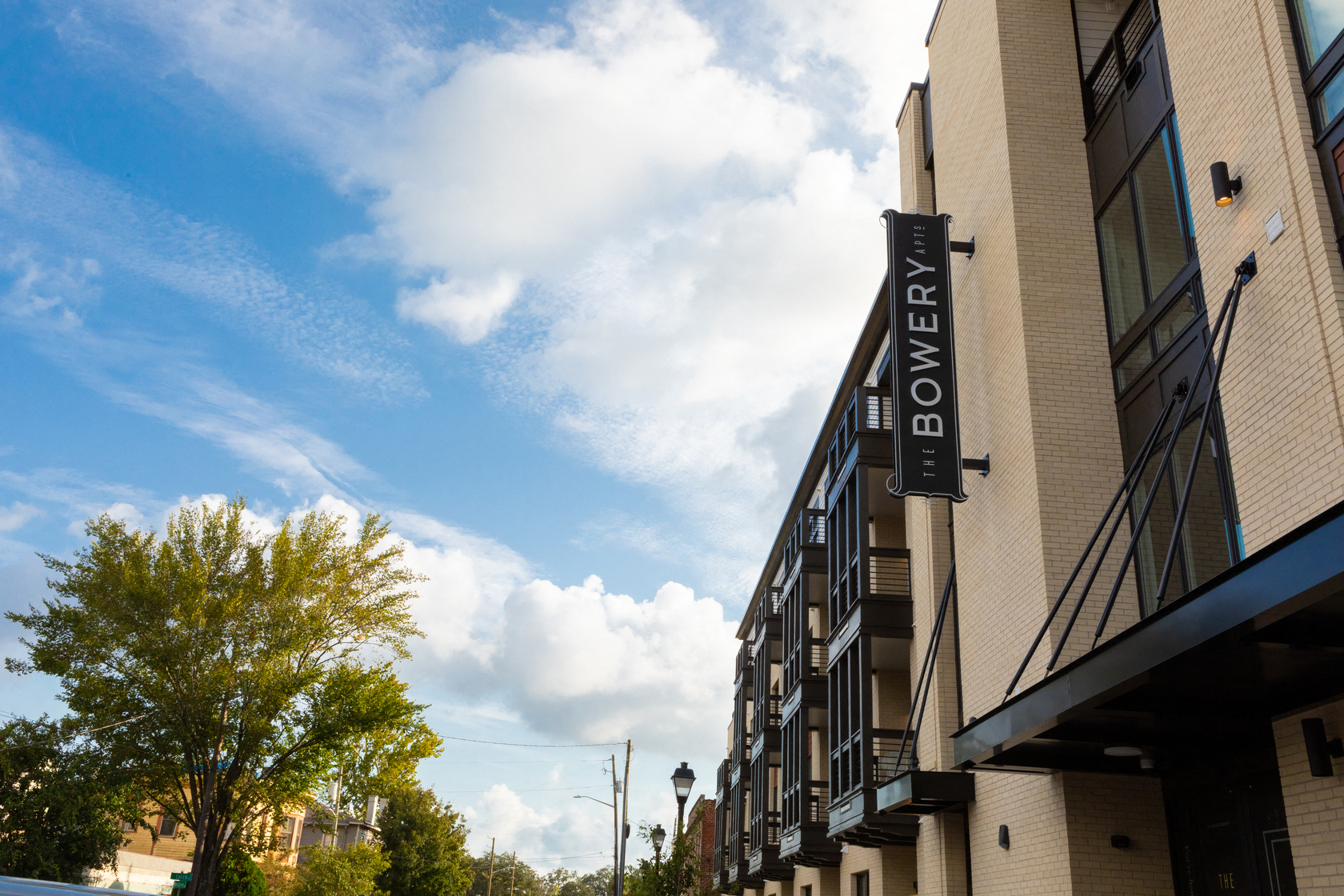a large hotel building with a sign on the side of it