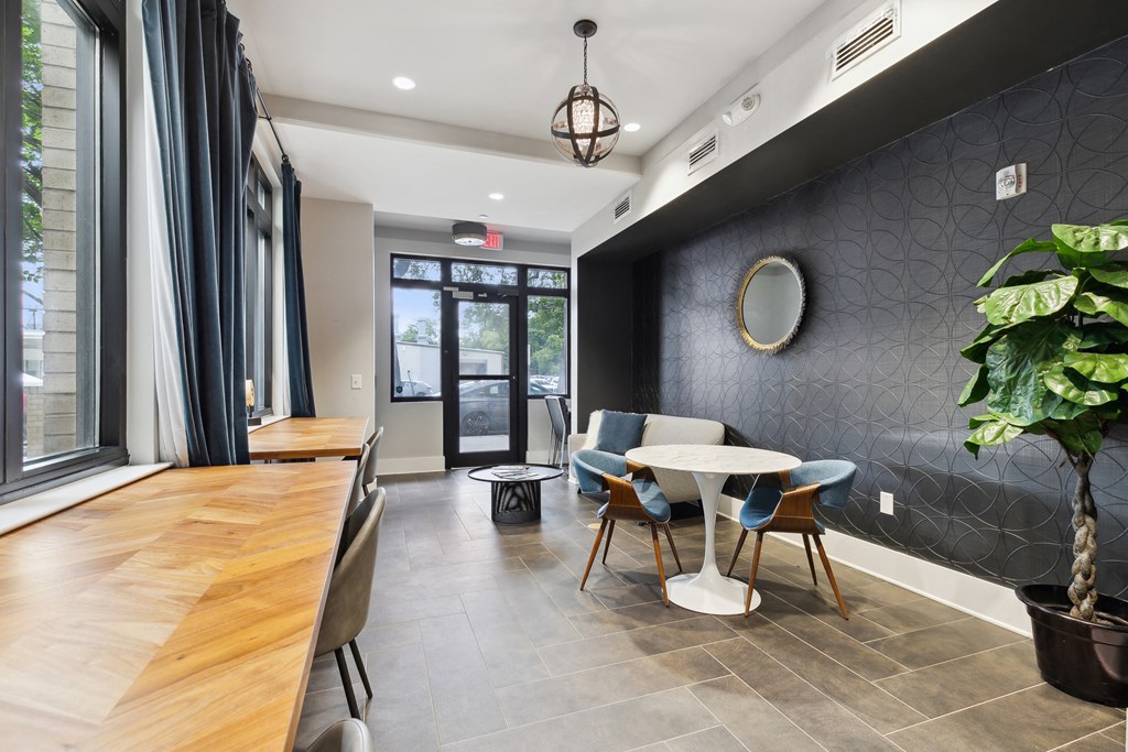 a dining room with a table and chairs and a window
