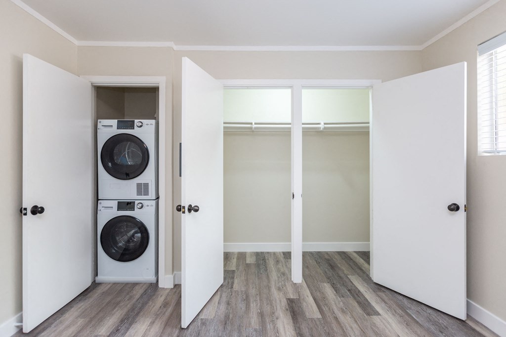 a laundry room with a washer and dryer in a closet