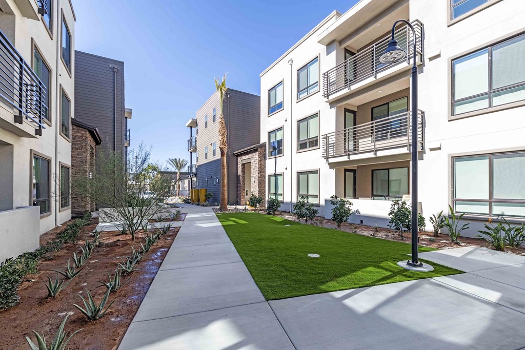 our apartments showcase a beautiful sidewalk and lush green landscaping