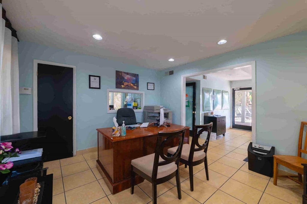 a dining room with a table and chairs in a house