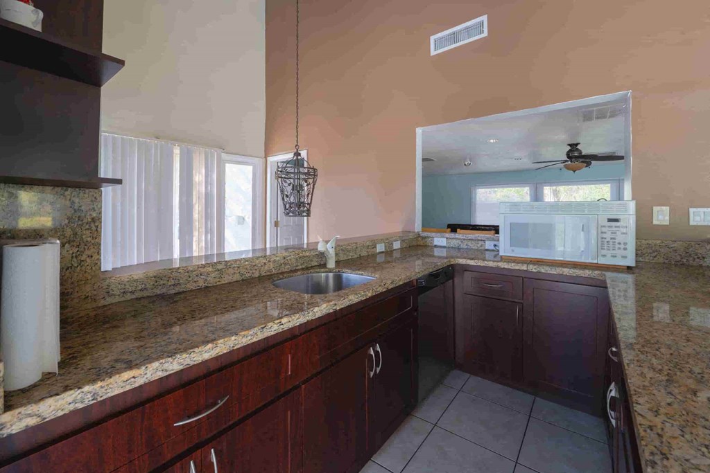 a kitchen with a sink and a counter top