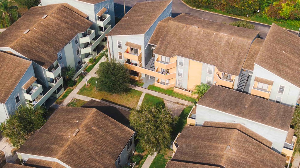 an aerial view of a group of houses with roofs