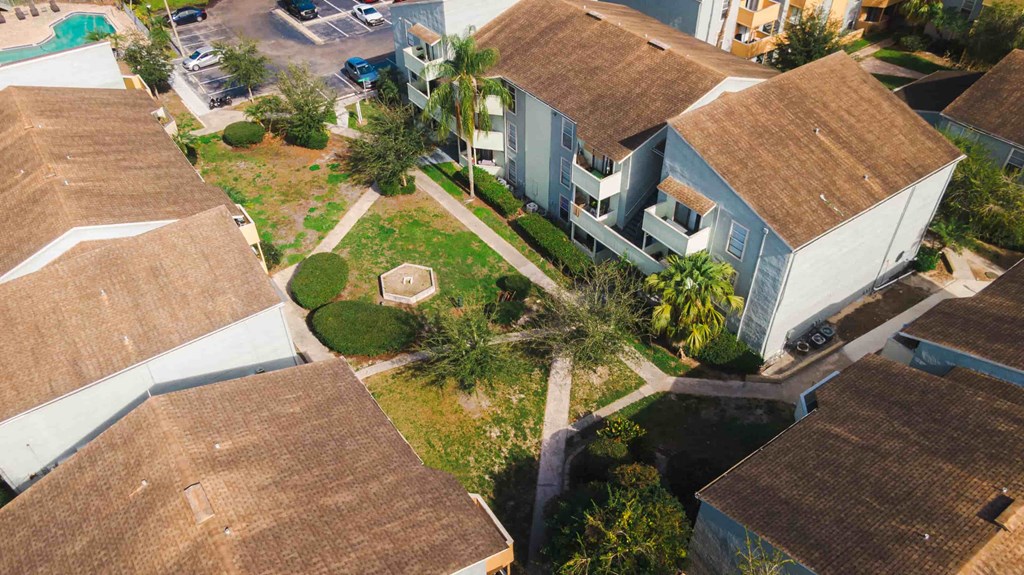 an aerial view of a neighborhood with houses and trees