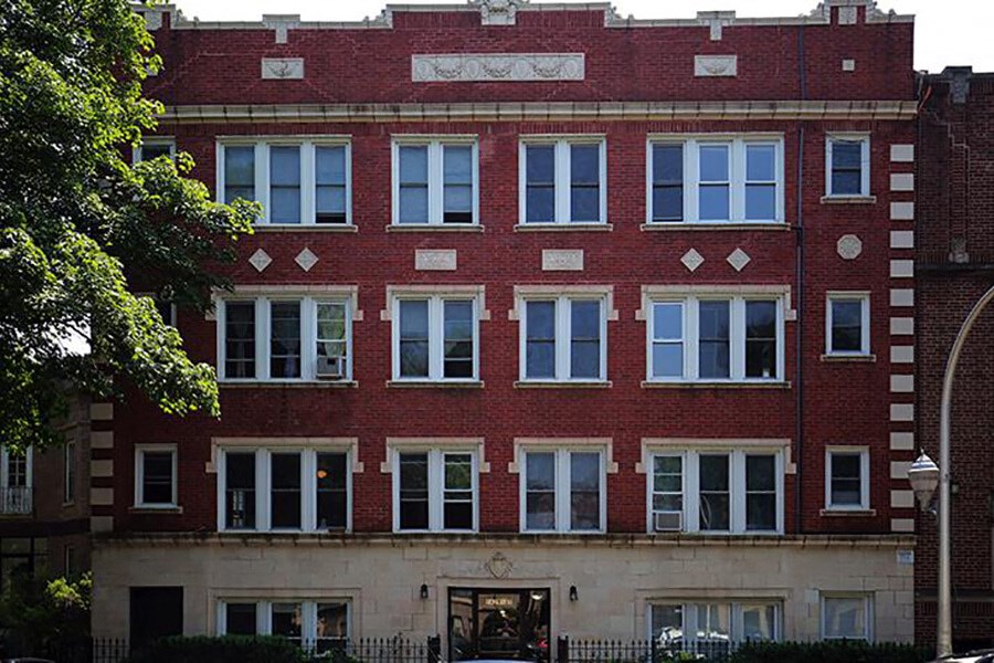 a red brick building with many windows on it