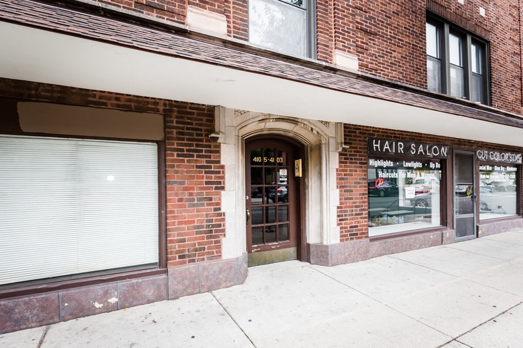 the facade of a hair salon on a city street
