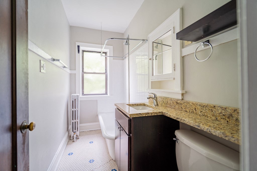 a bathroom with a sink toilet and a shower