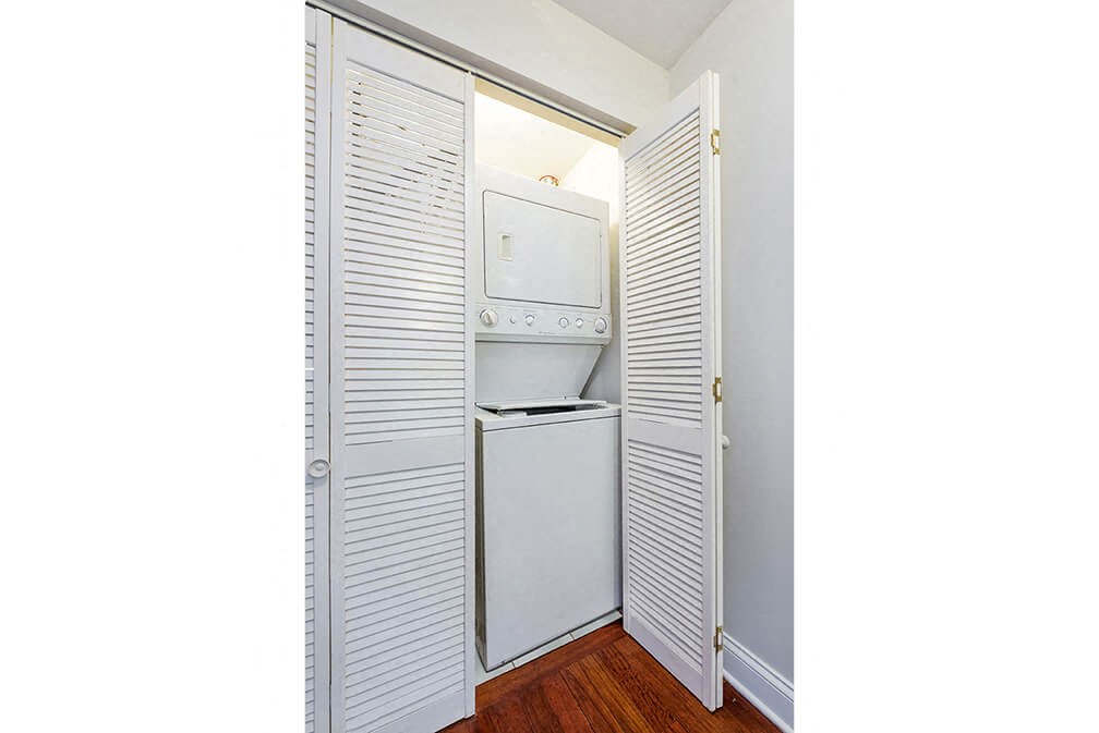 a small laundry room with a washer and dryer in it