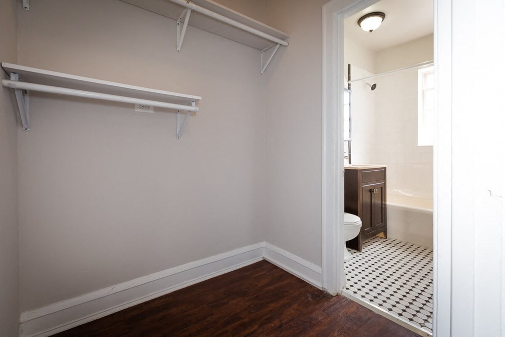 a bathroom with a toilet and a sink and a shower