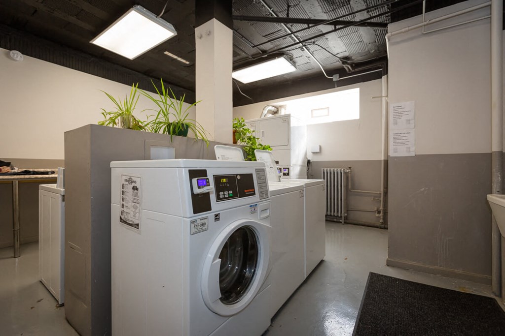 a washing machine and a dryer in a laundry room
