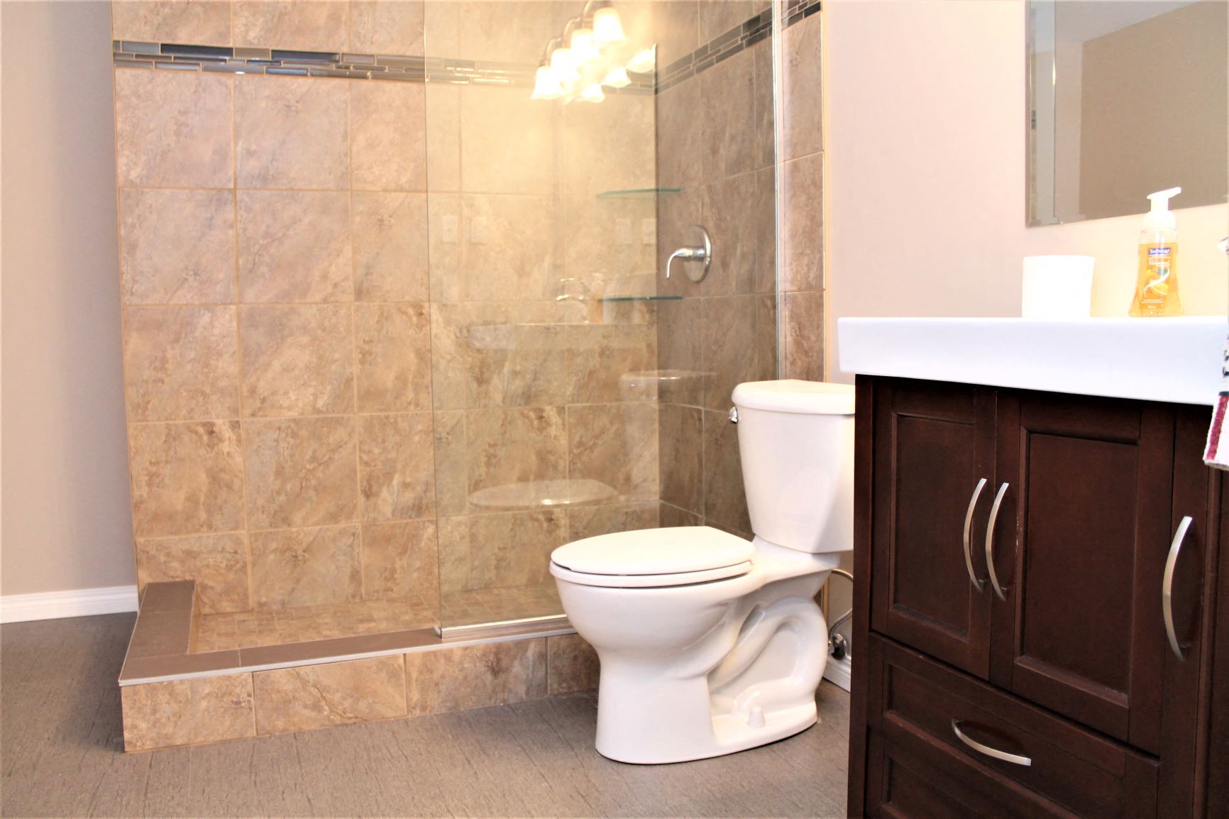 a bathroom with a toilet and a shower