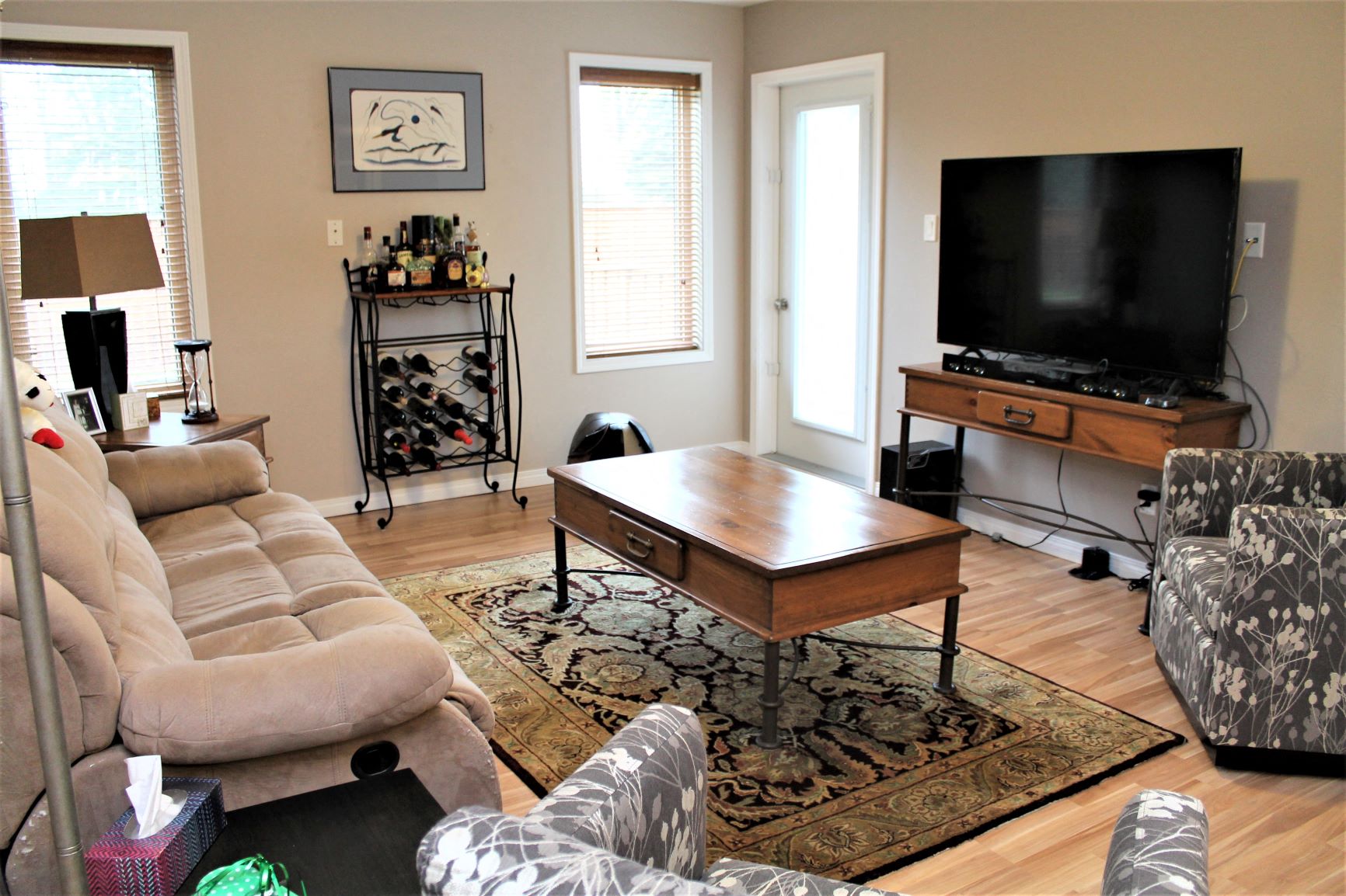 a living room with a couch a table and a television
