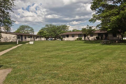 a yard in front of some houses