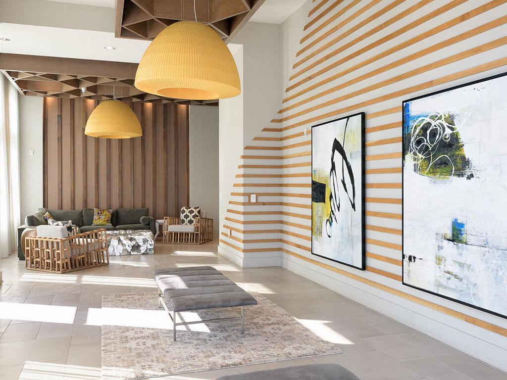 a living room with striped walls and a couch and a table