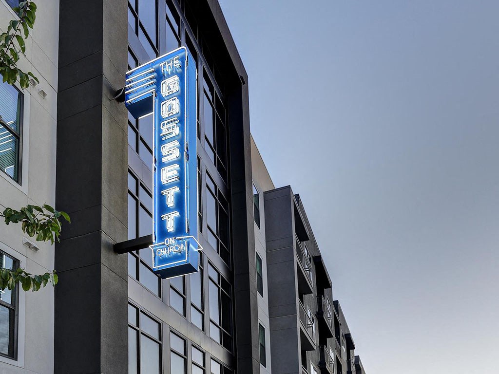a blue sign on the side of a building