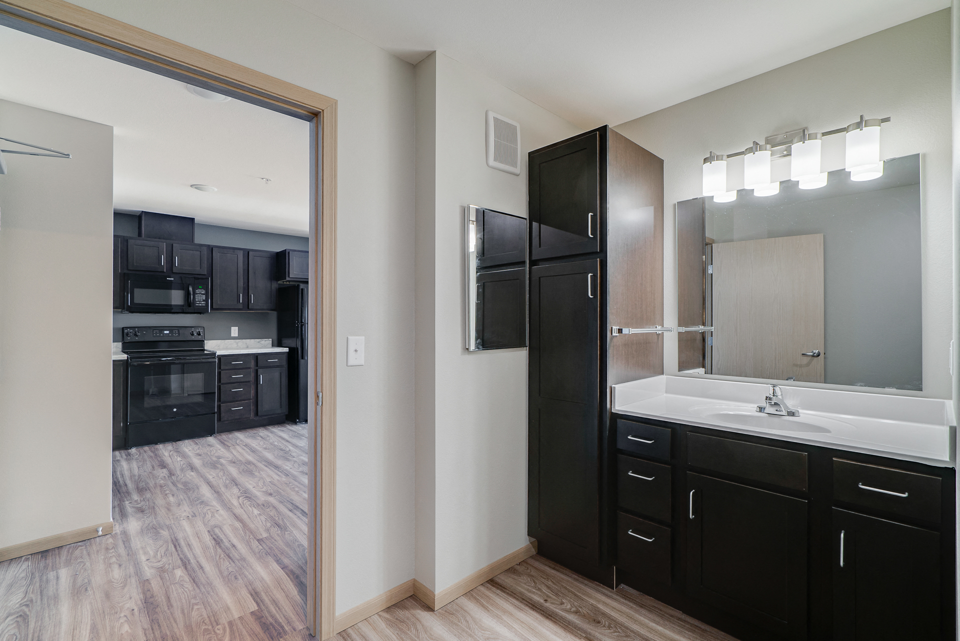 a view of a kitchen and a mirror in a house