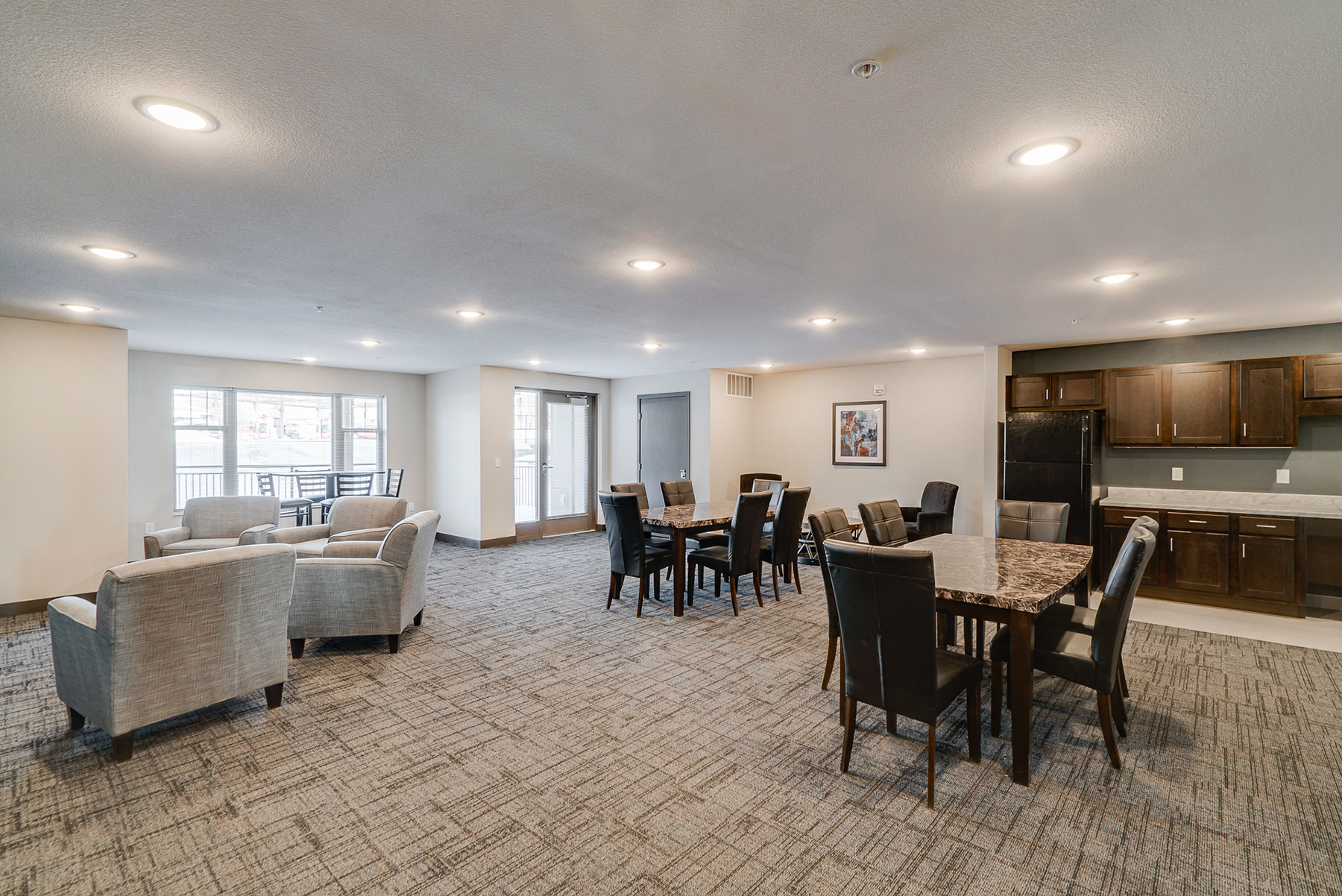 an open living room and dining room with a table and chairs