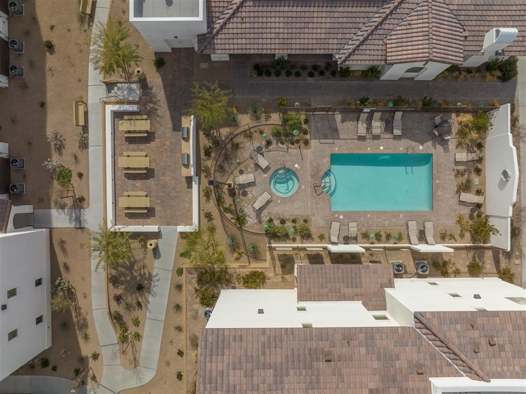 a birds eye view of the roof of a house with a swimming pool