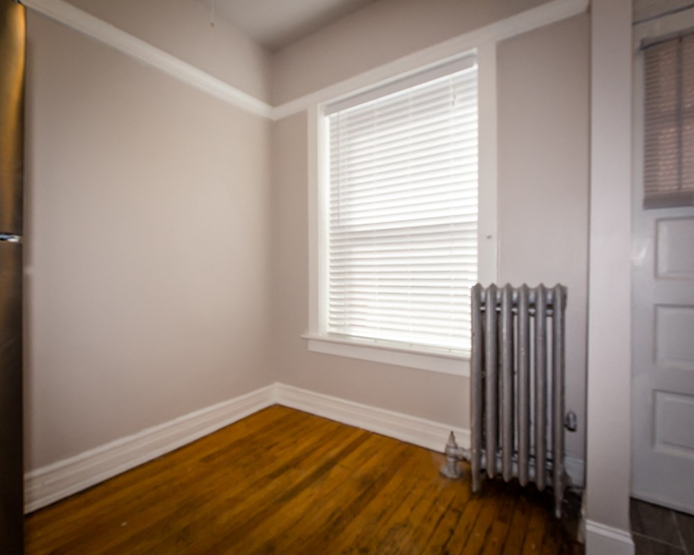 a room with a radiator and a window