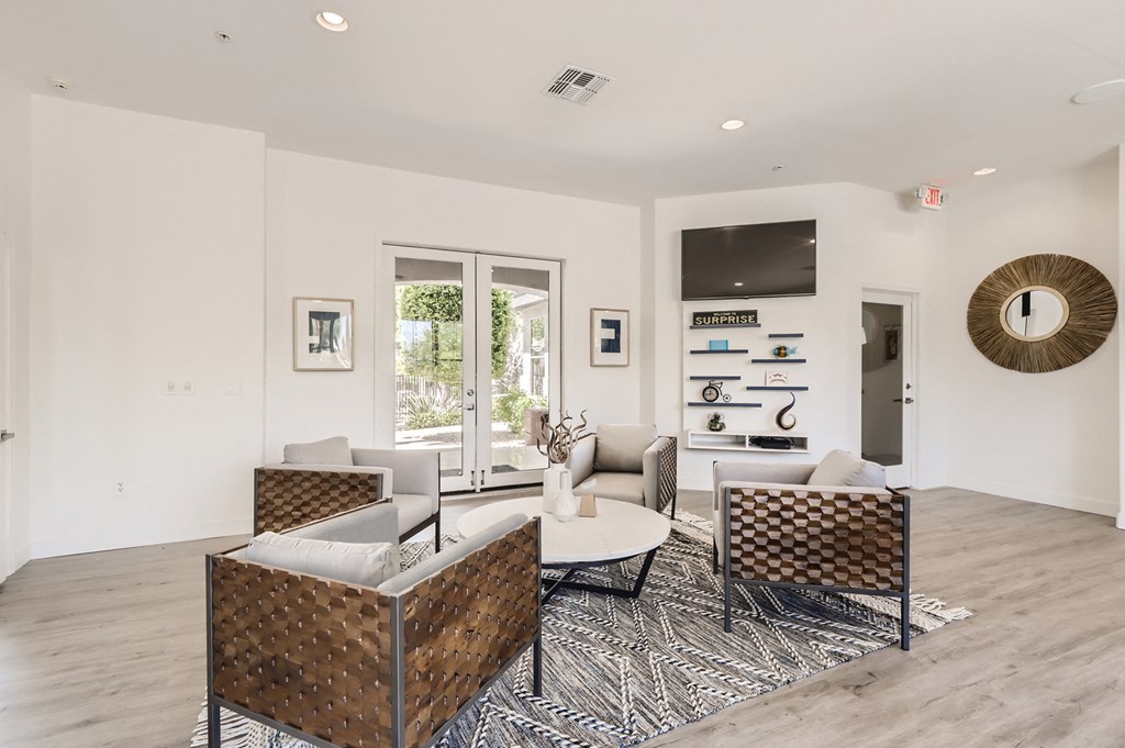 a living room with couches and chairs and a table