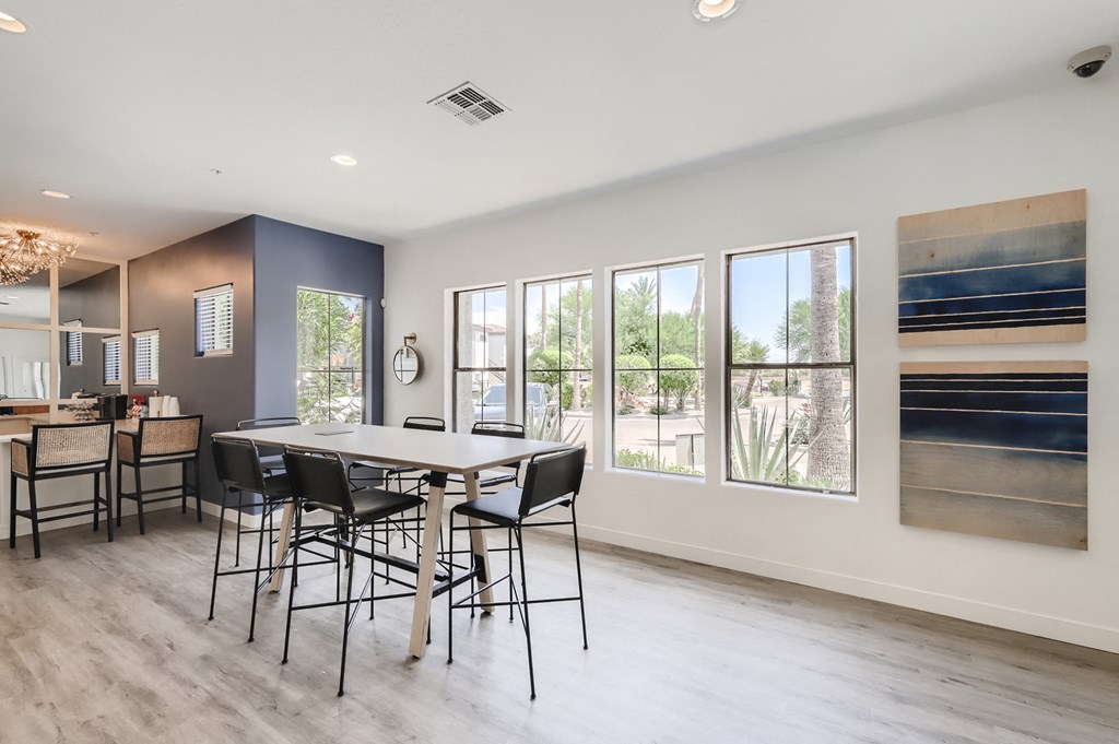 a dining room with a table and chairs