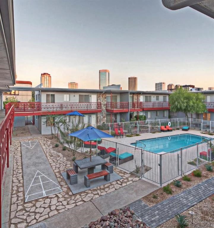 a view of a pool and a building with a pool