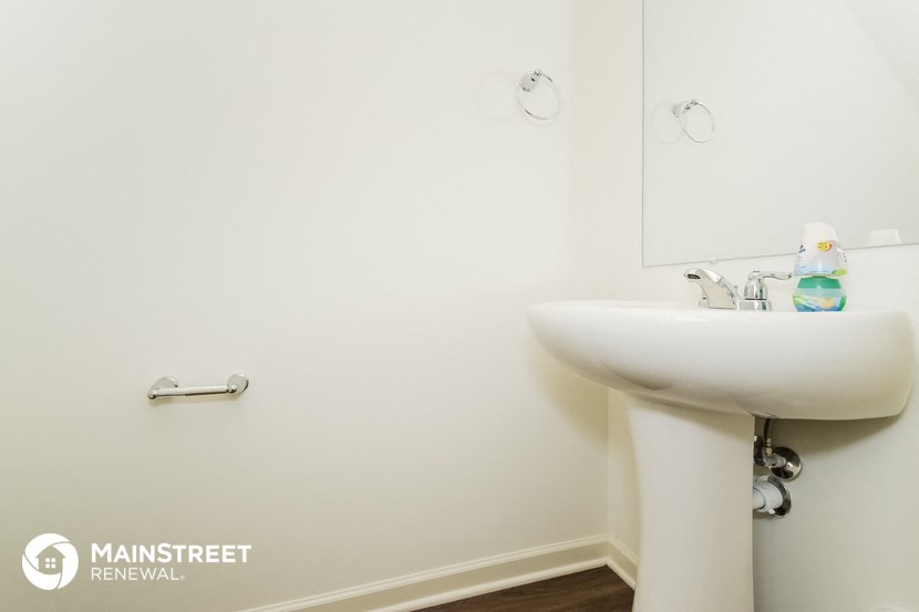 a small bathroom with a sink and a mirror