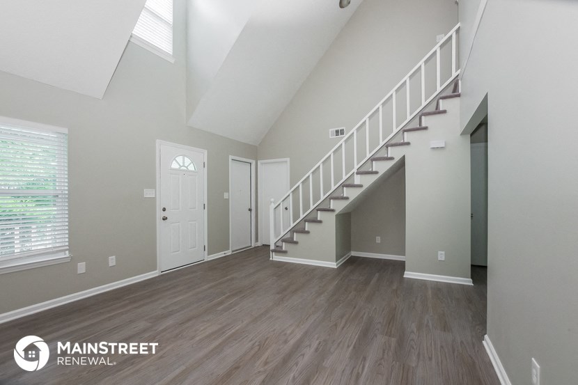 the upstairs living room with stairs to the loft