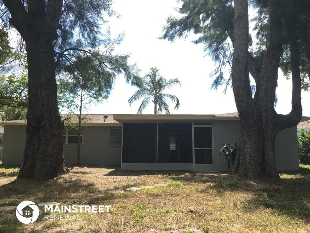 a home with two trees in front of it
