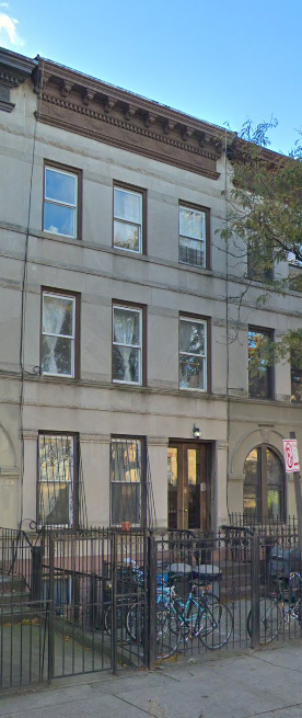 A building with a brown top and windows.