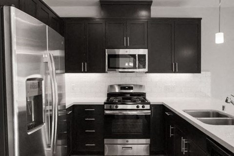 a kitchen with a stove and a refrigerator
