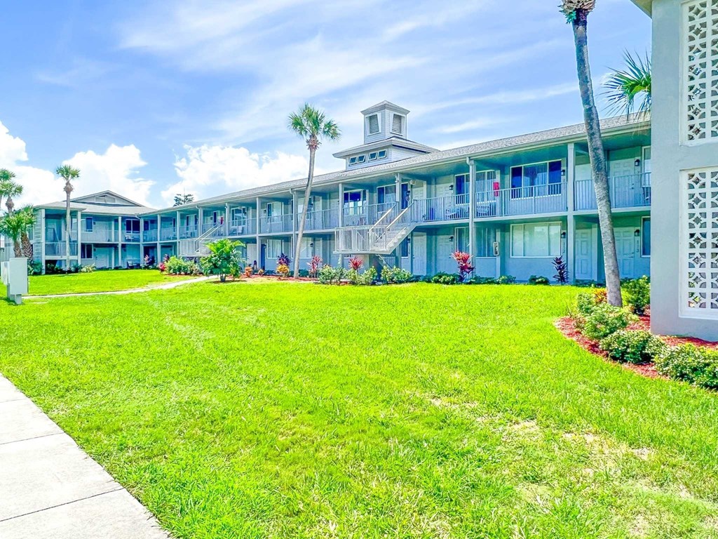 a building with a green lawn in front of it