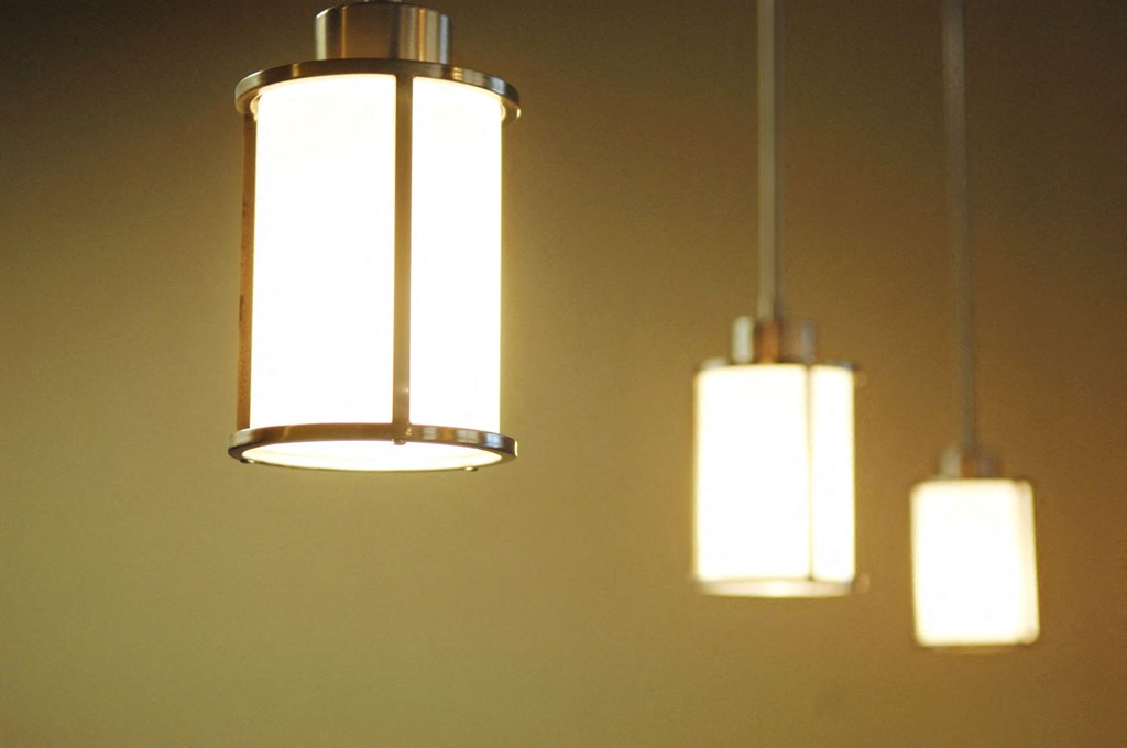 Two hanging lights with a warm glow at Centre Place Apartments, Denton, 76205